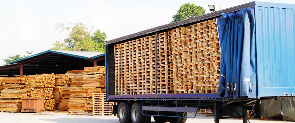 lorry with wooden pallets stacked inside